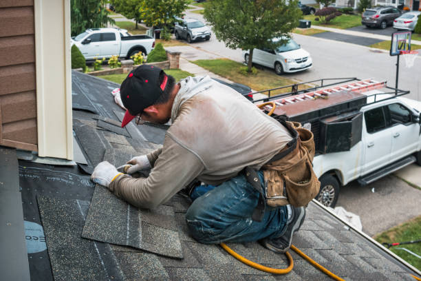 Professional Storm Damage Roof Repair technician working in Elk Rapids, MI